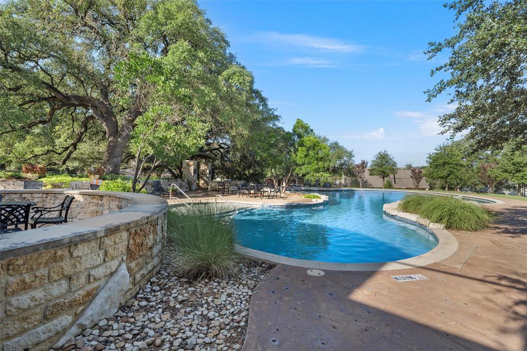 17001 Escondida Court Woodway, TX 76712 - Photo 38 of 40 a view of a backyard with swimming pool