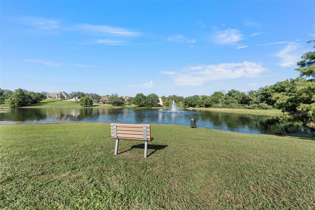 17001 Escondida Court Woodway, TX 76712 - Photo 40 of 40 a view of a lake with a table and chairs