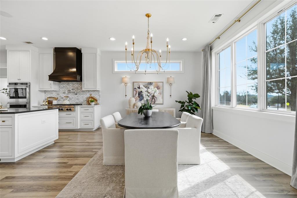 17001 Escondida Court Woodway, TX 76712 - Photo 7 of 40 a view of a living room and kitchen with furniture window