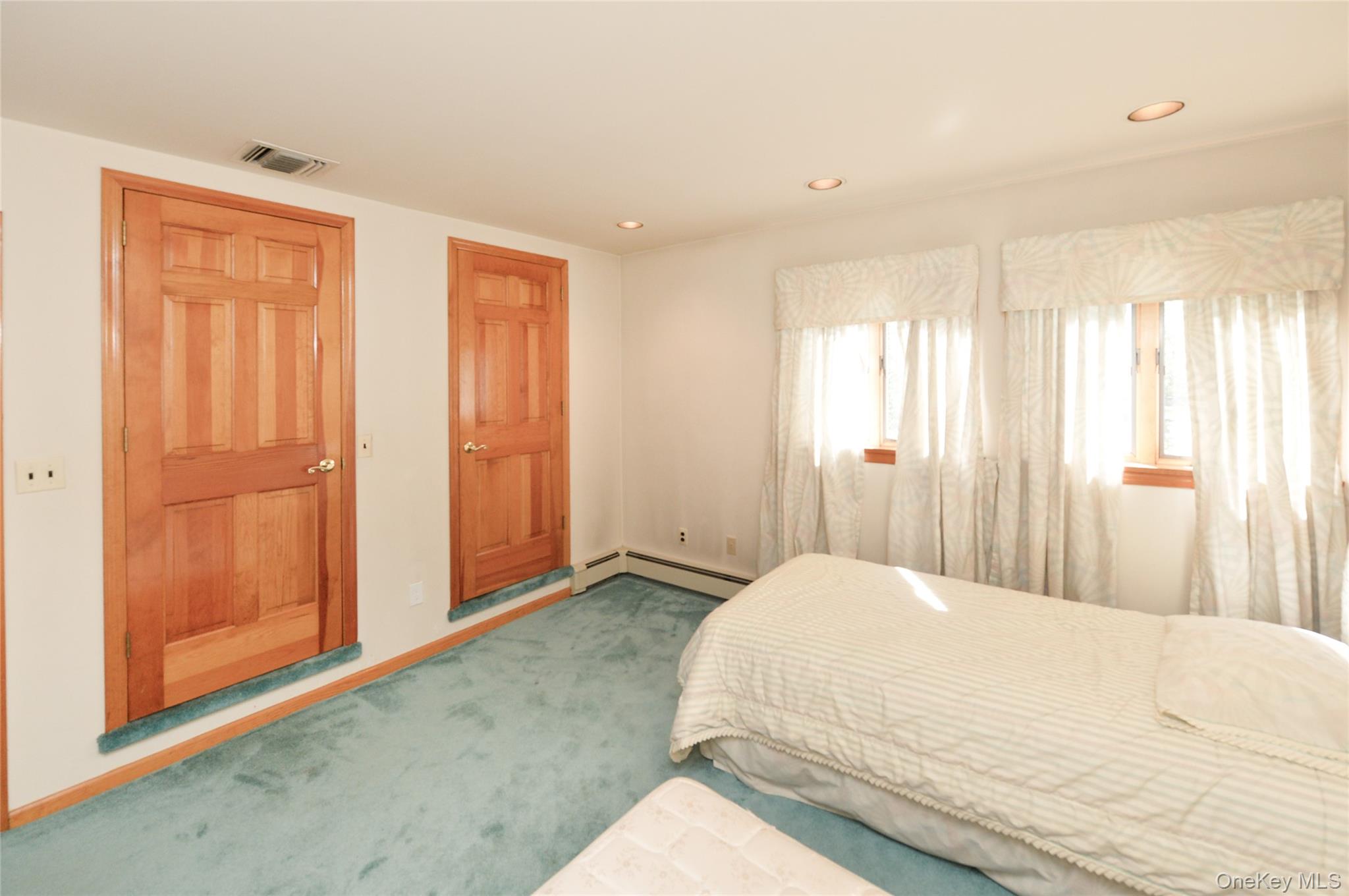 24 Highview Road Monsey, NY 10952 - Photo 32 of 44 a large bedroom with a bed and wooden floor