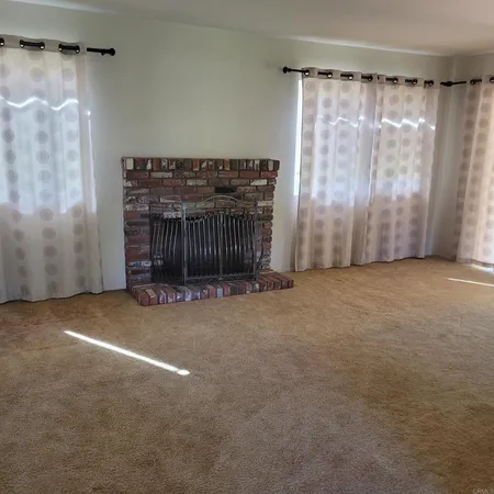 a view of empty room with a ceiling fan
