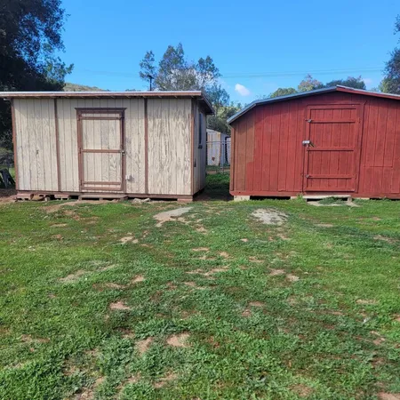 a big yard with wooden fence
