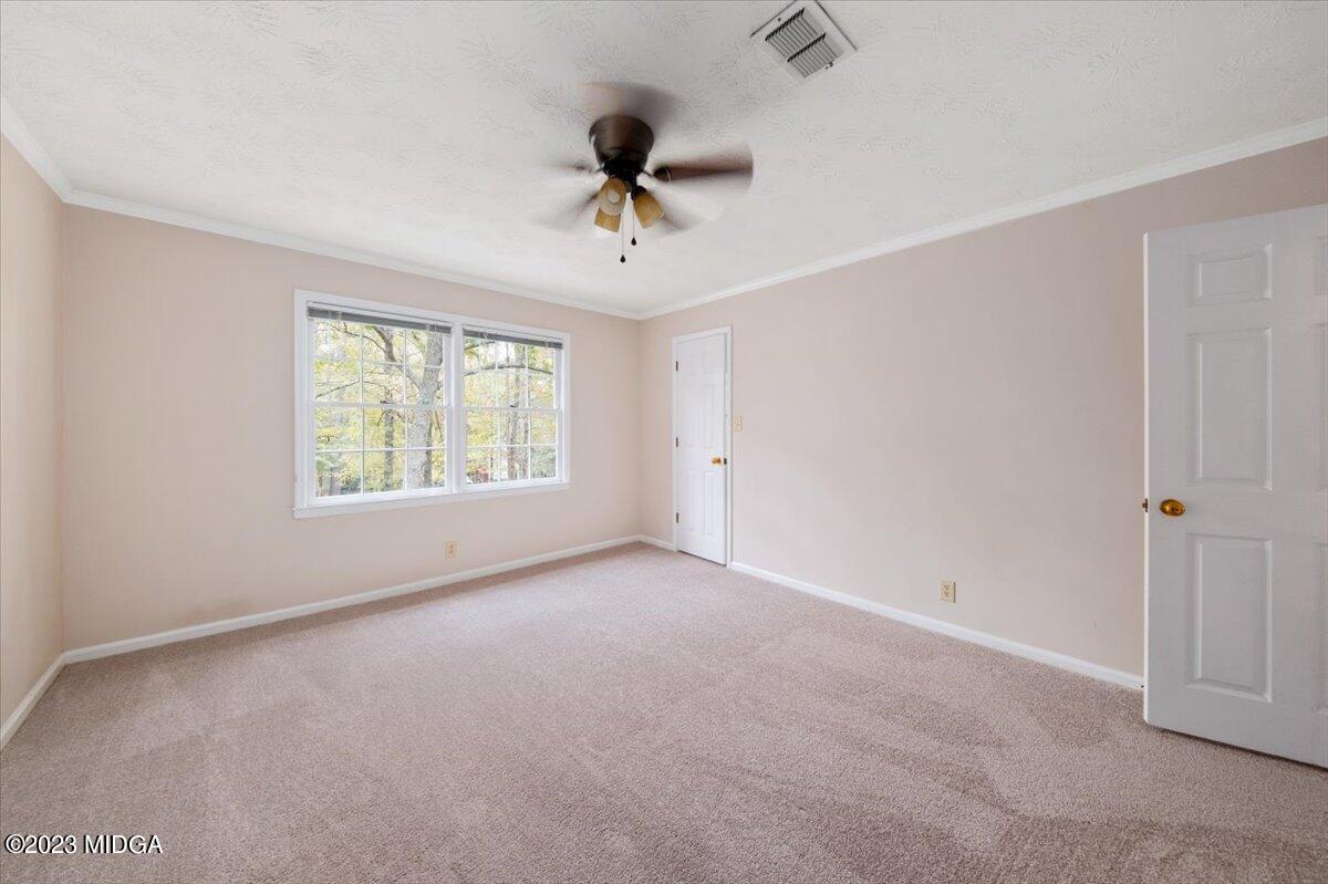 1434 Craddock Way Macon, GA 31210 - Photo 18 of 32 a view of an empty room with a window