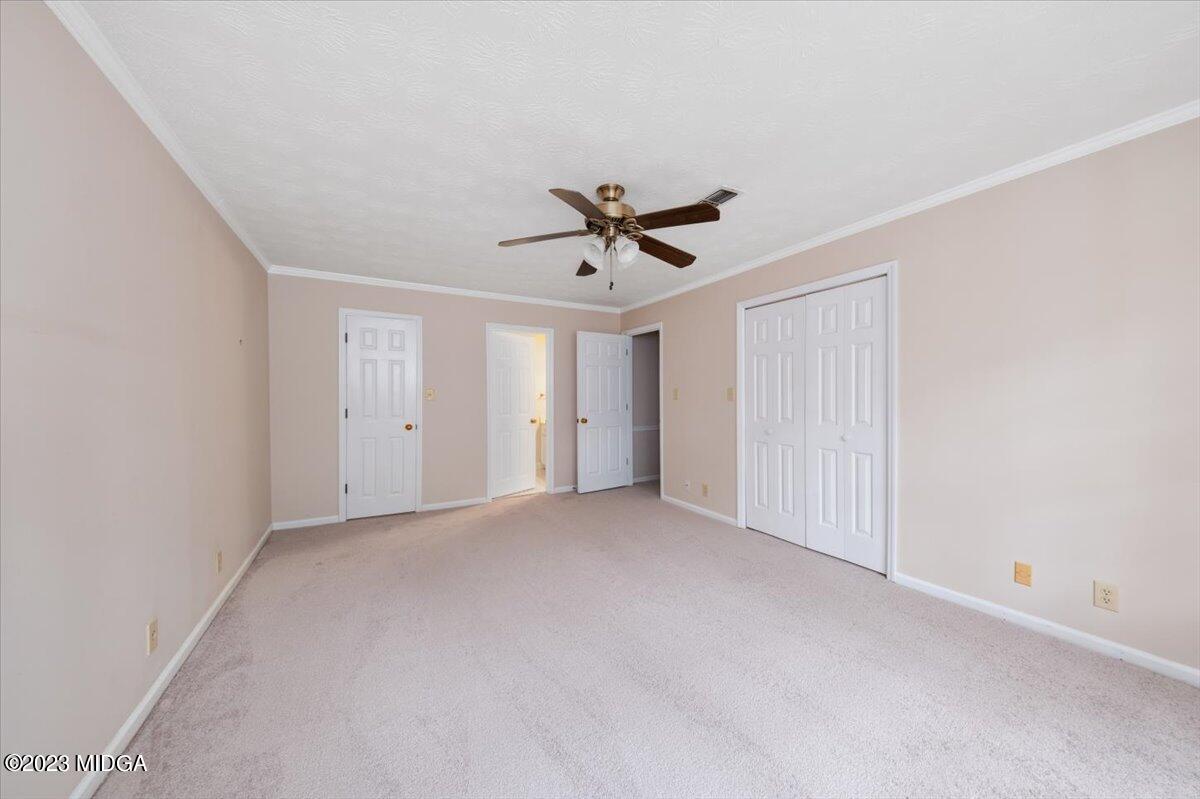 1434 Craddock Way Macon, GA 31210 - Photo 22 of 32 a view of an empty room with a ceiling fan