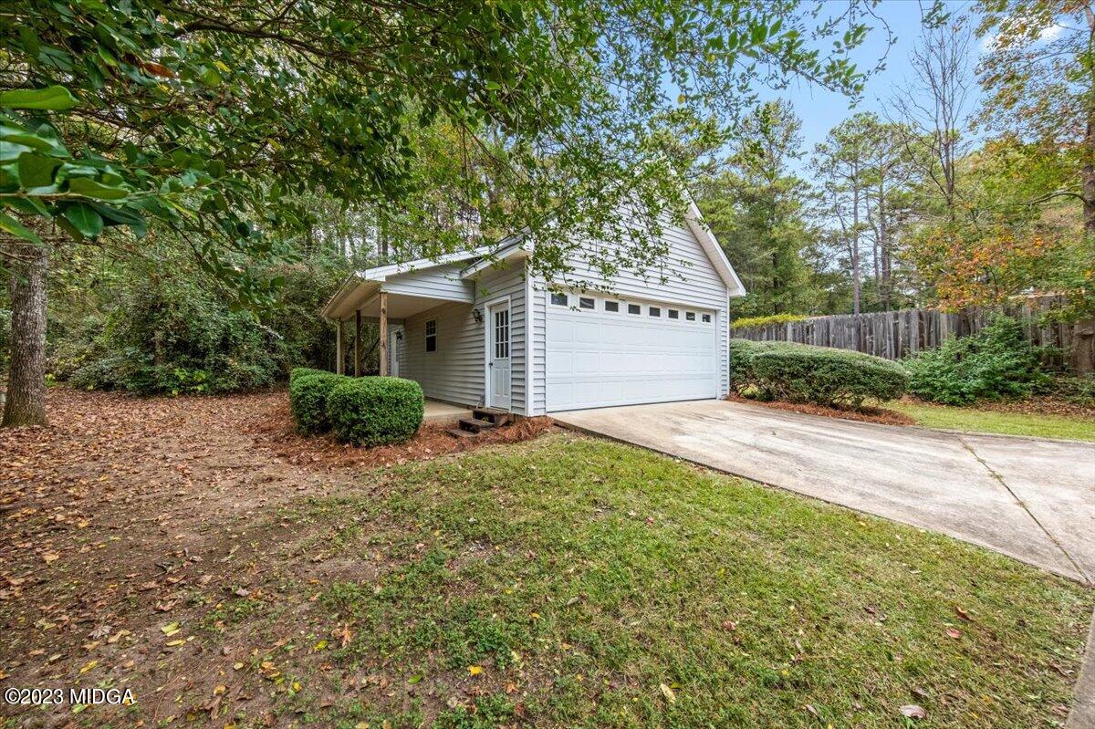 1434 Craddock Way Macon, GA 31210 - Photo 27 of 32 a front view of a house with garden