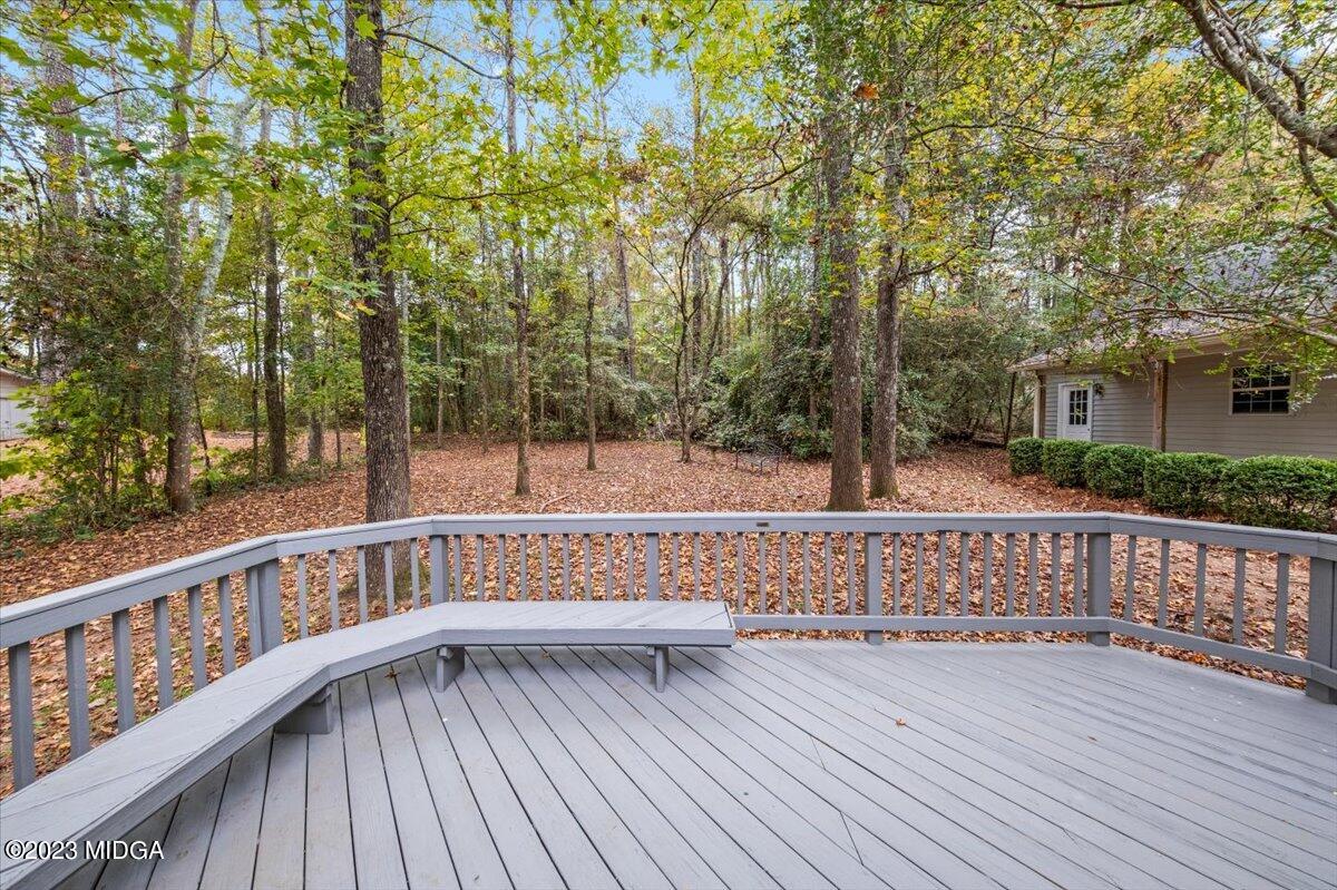 1434 Craddock Way Macon, GA 31210 - Photo 4 of 32 a view of deck with trees and wooden fence