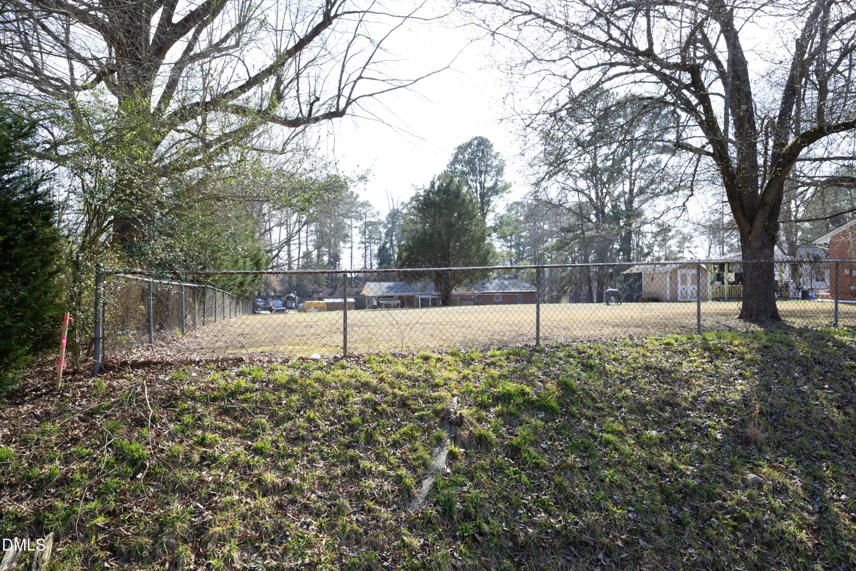 3504 Skycrest Drive Raleigh, NC 27604 - Photo 9 of 10 a view of a yard with large trees
