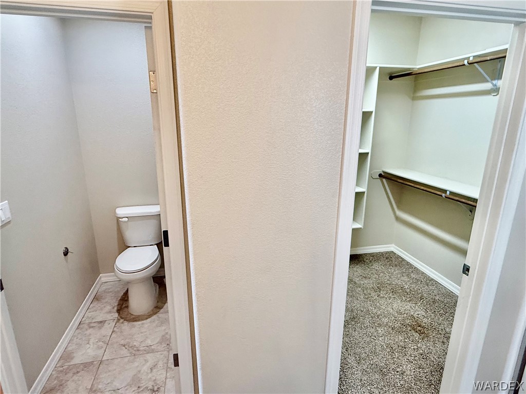 5392 Rattlesnake Road Kingman, AZ 86409 - Photo 20 of 35 a bathroom with a toilet