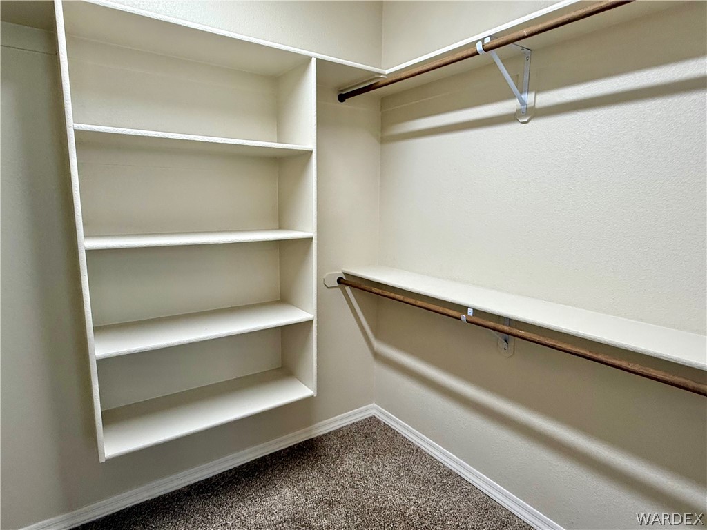 5392 Rattlesnake Road Kingman, AZ 86409 - Photo 21 of 35 a view of walk in closet with empty racks