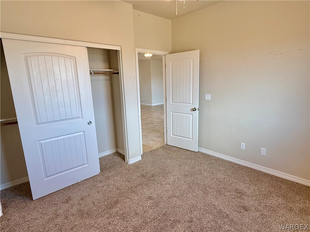 5392 Rattlesnake Road Kingman, AZ 86409 - Photo 24 of 35 an empty room with a door