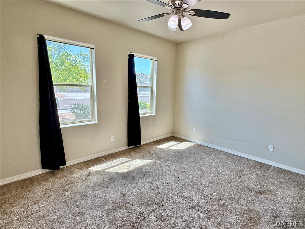 5392 Rattlesnake Road Kingman, AZ 86409 - Photo 27 of 35 a view of an empty room with a window