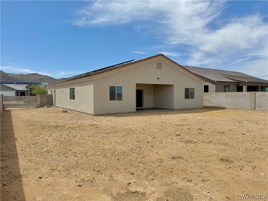 5392 Rattlesnake Road Kingman, AZ 86409 - Photo 30 of 35 a view of house with yard