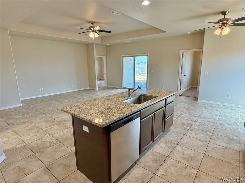 5392 Rattlesnake Road Kingman, AZ 86409 - Photo 9 of 35 a kitchen with a sink cabinets and chandelier