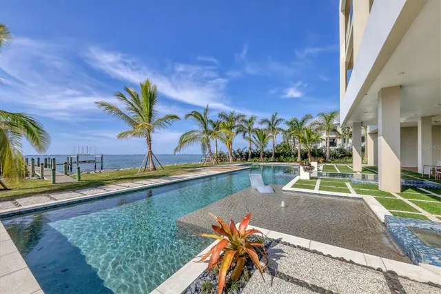 a view of a house with a backyard and porch