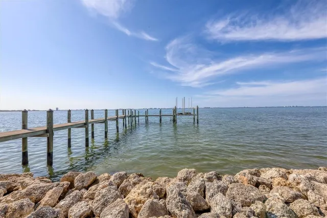 a view of swimming pool with chairs