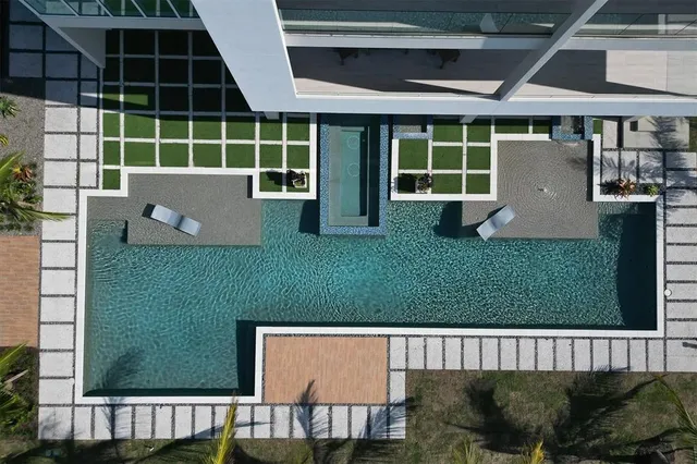 a lobby with furniture and floor to ceiling window