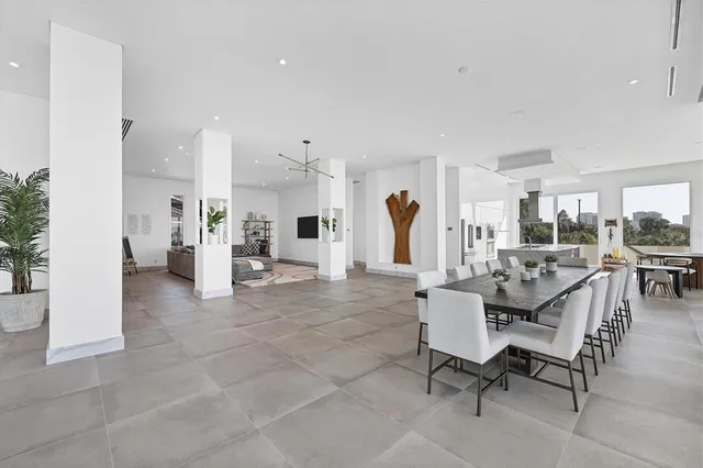 a large kitchen with a stove a refrigerator and a sink