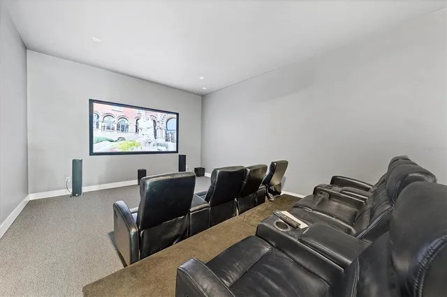 a view of swimming pool with seating space and yard