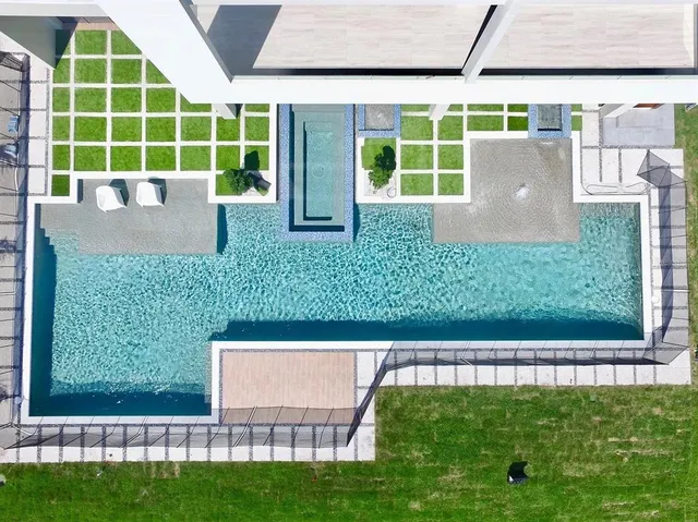 an aerial view of a house with a lake view