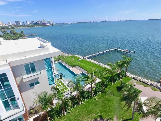 a view of a swimming pool with a lounge chairs