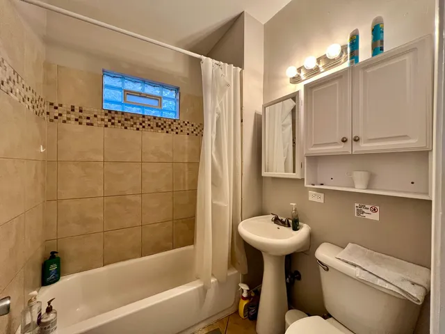 a bathroom with a sink a bathtub and a toilet