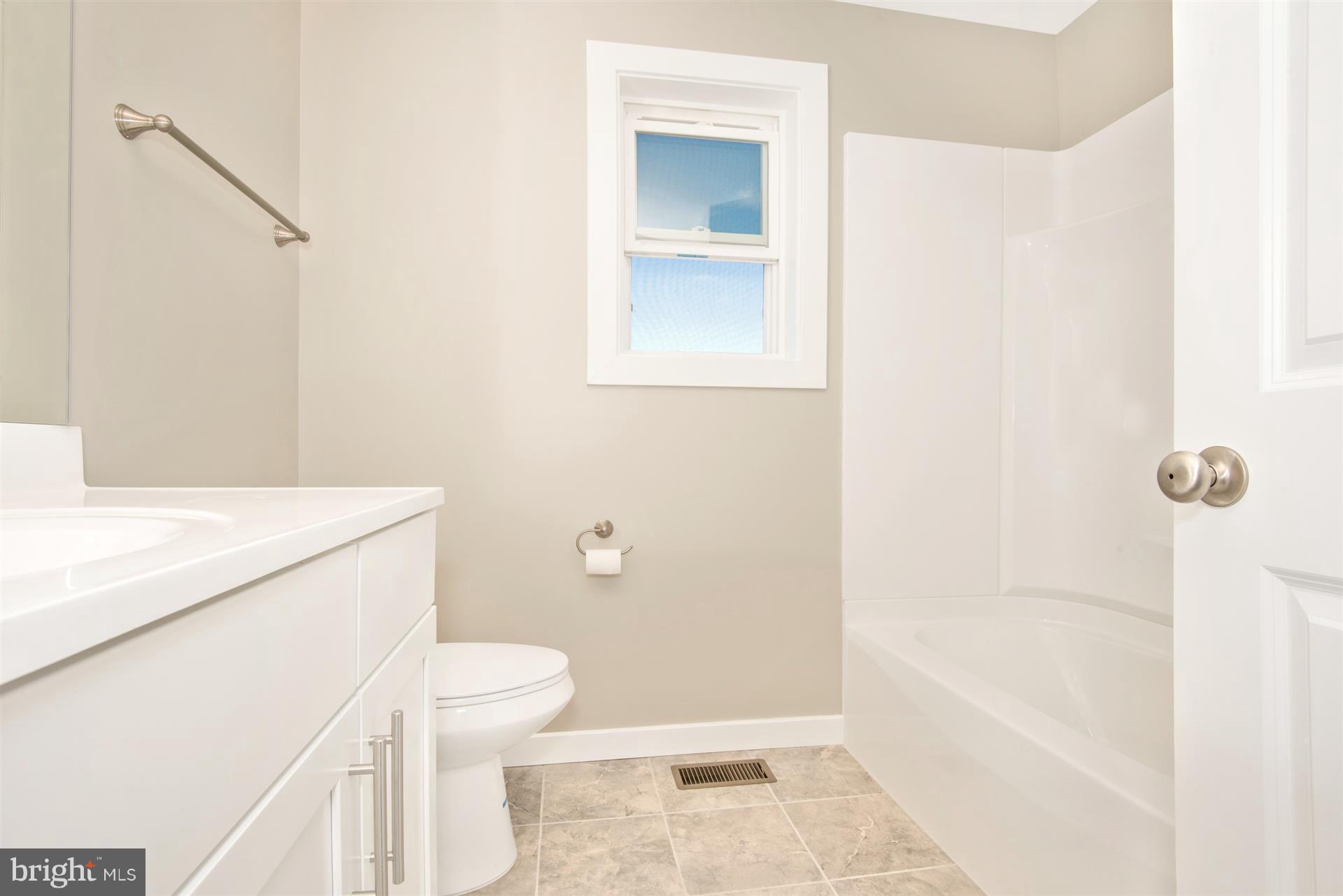 4235 Horine Road Jefferson, MD 21755 - Photo 2 of 24 a bathroom with a sink a toilet and shower