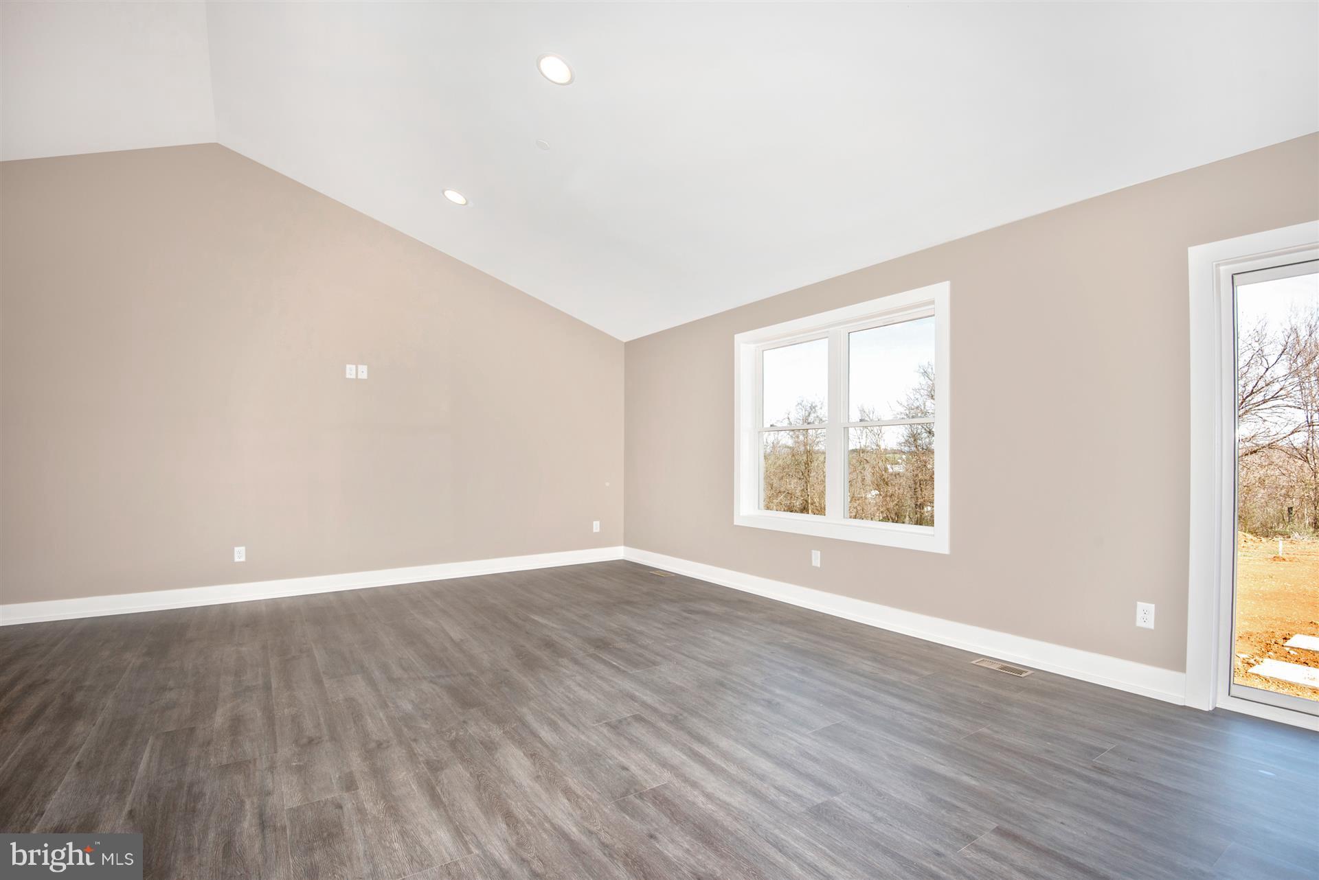 4235 Horine Road Jefferson, MD 21755 - Photo 11 of 24 a view of an empty room with wooden floor and a window