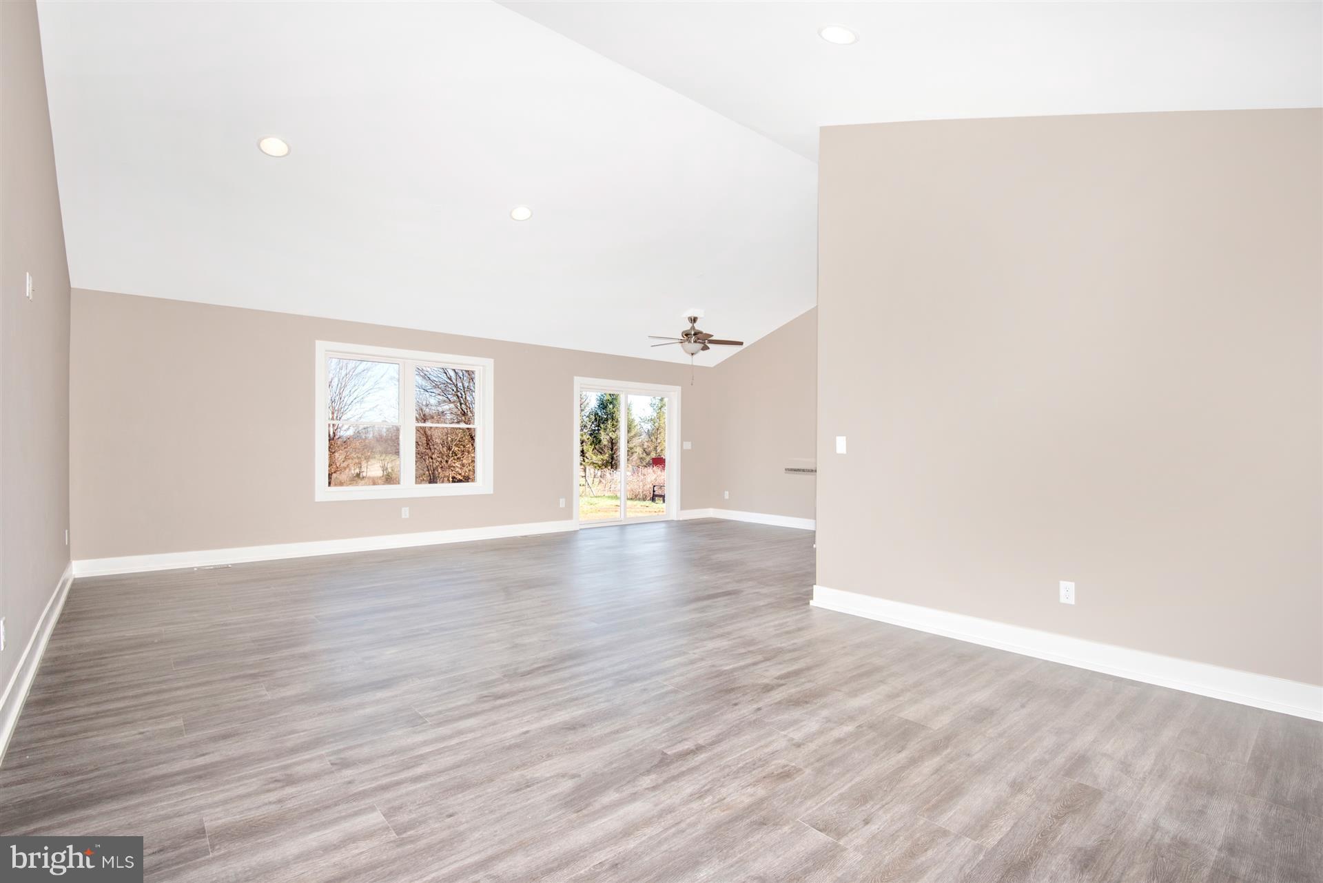 4235 Horine Road Jefferson, MD 21755 - Photo 13 of 24 an empty room with wooden floor and windows