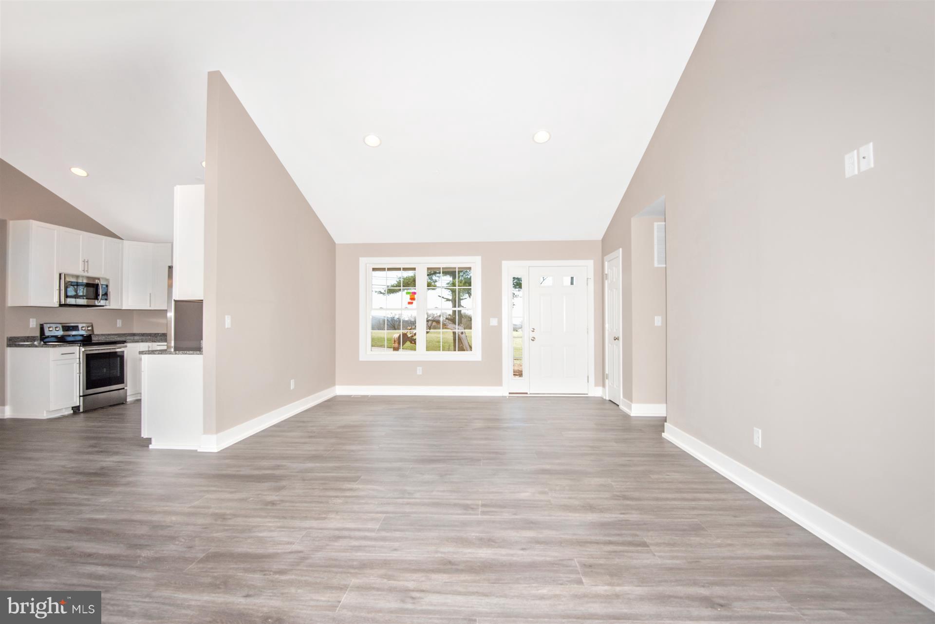 4235 Horine Road Jefferson, MD 21755 - Photo 14 of 24 a view of an empty room with wooden floor and a window