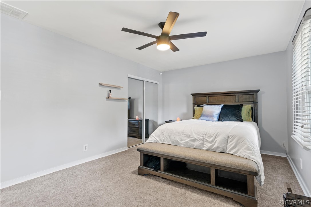 10731 Timberun Road Chesterfield, VA 23832 - Photo 16 of 25 a bedroom with a bed and a ceiling fan