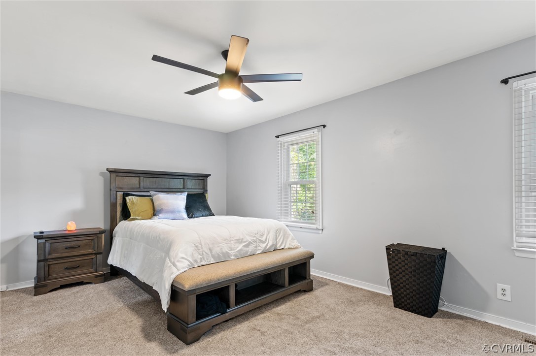 10731 Timberun Road Chesterfield, VA 23832 - Photo 18 of 25 a bedroom with a bed and a chandelier