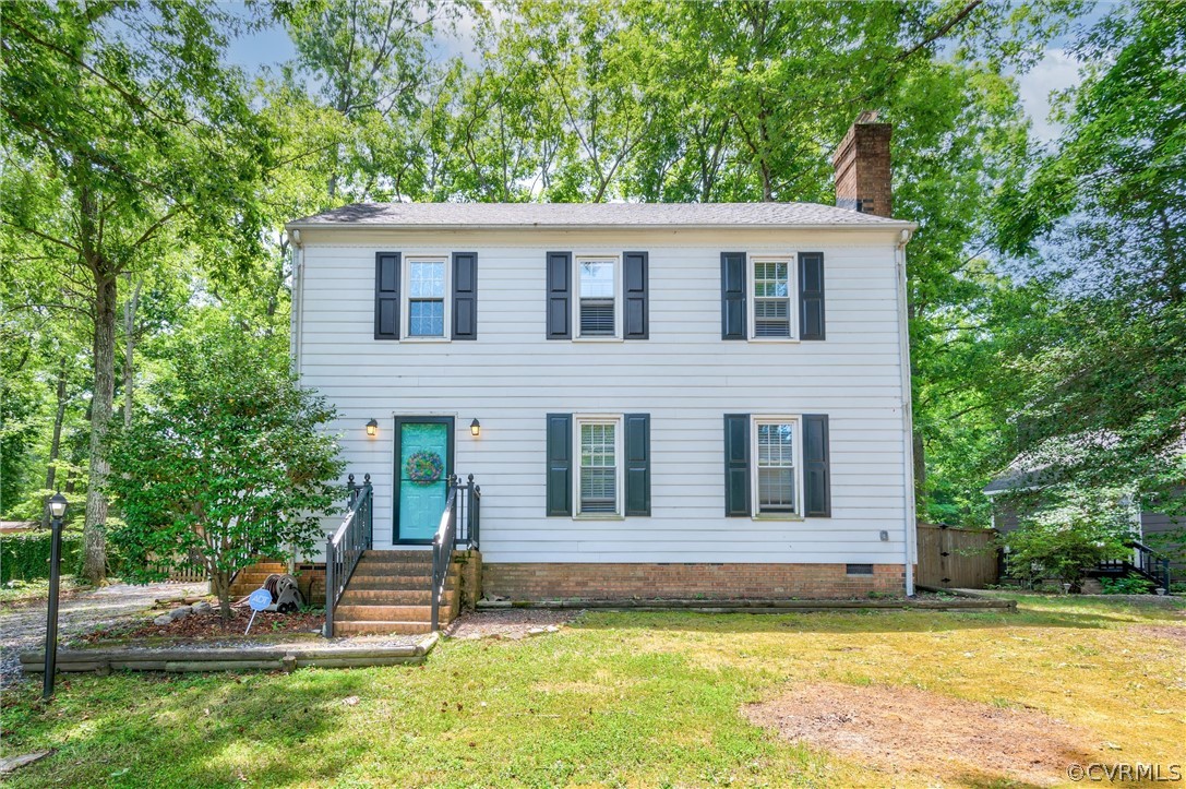10731 Timberun Road Chesterfield, VA 23832 - Photo 2 of 25 a view of a house with a patio and a yard