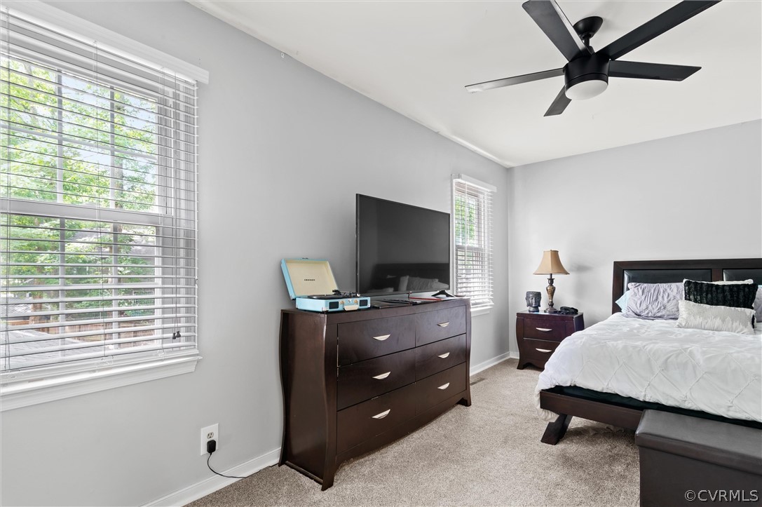 10731 Timberun Road Chesterfield, VA 23832 - Photo 21 of 25 a bedroom with a bed and a flat screen tv