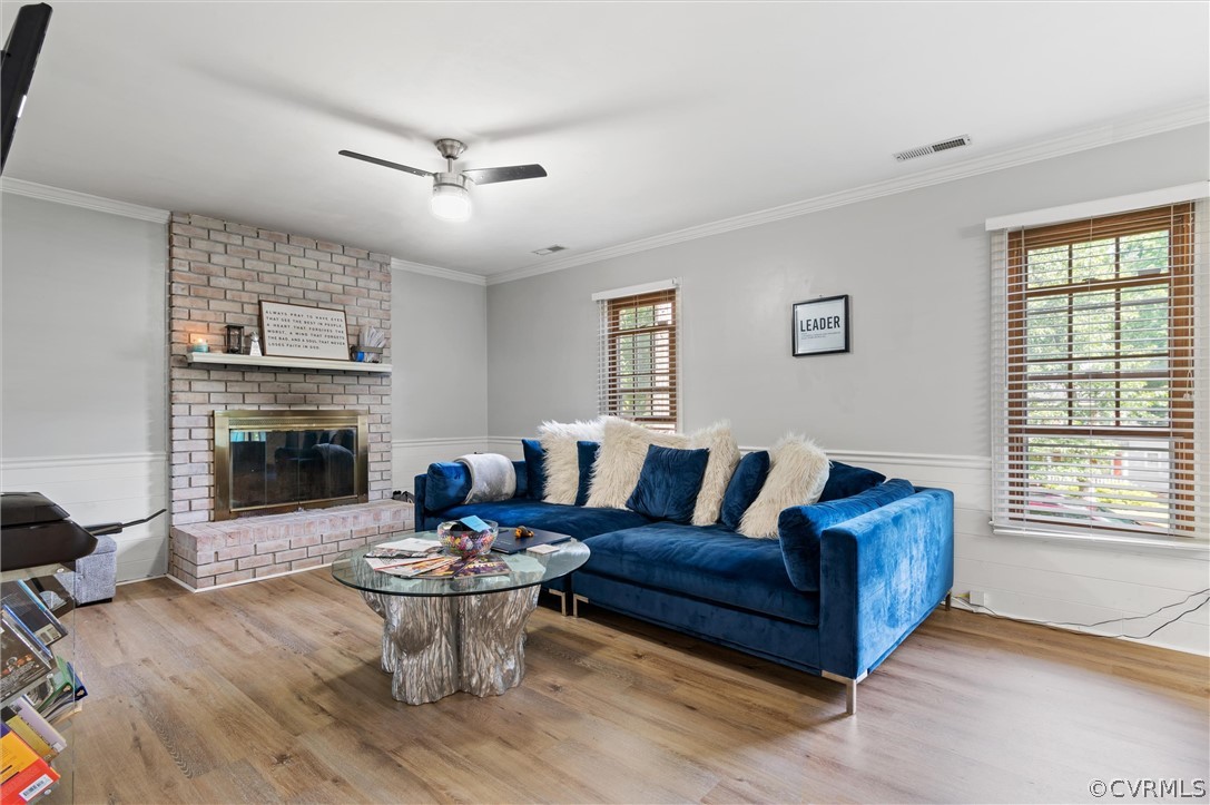 10731 Timberun Road Chesterfield, VA 23832 - Photo 4 of 25 a living room with furniture a fireplace and a table