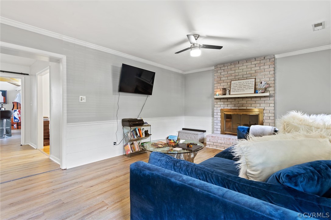 10731 Timberun Road Chesterfield, VA 23832 - Photo 5 of 25 a living room with furniture and a flat screen tv