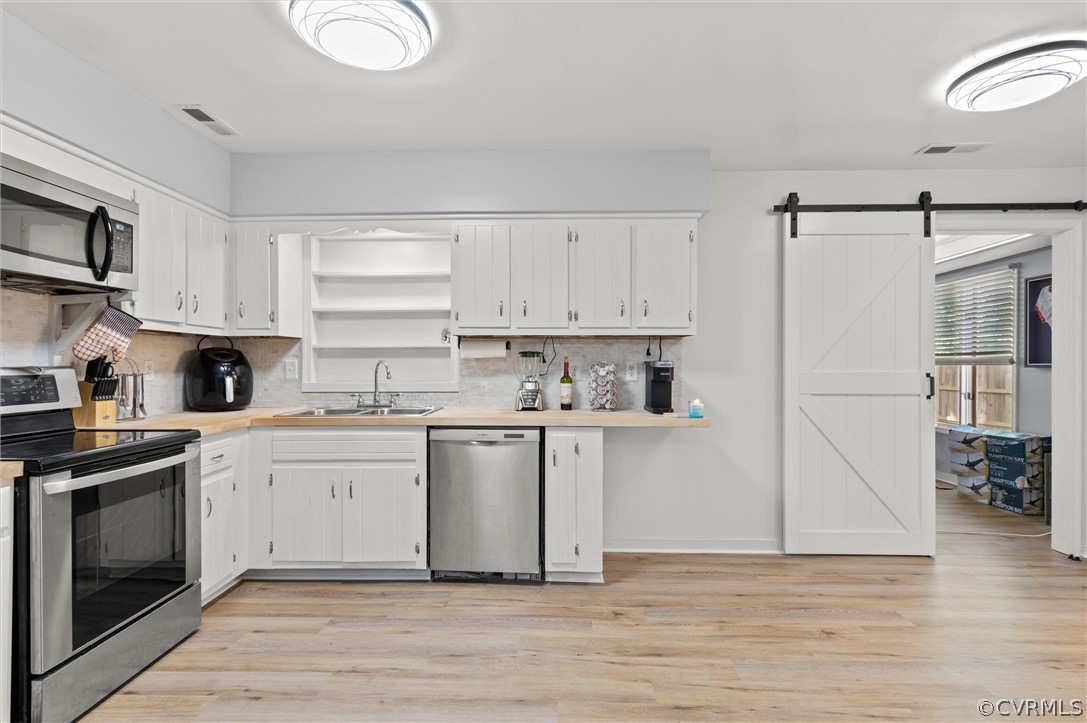 10731 Timberun Road Chesterfield, VA 23832 - Photo 7 of 25 a kitchen with a white cabinets and white appliances