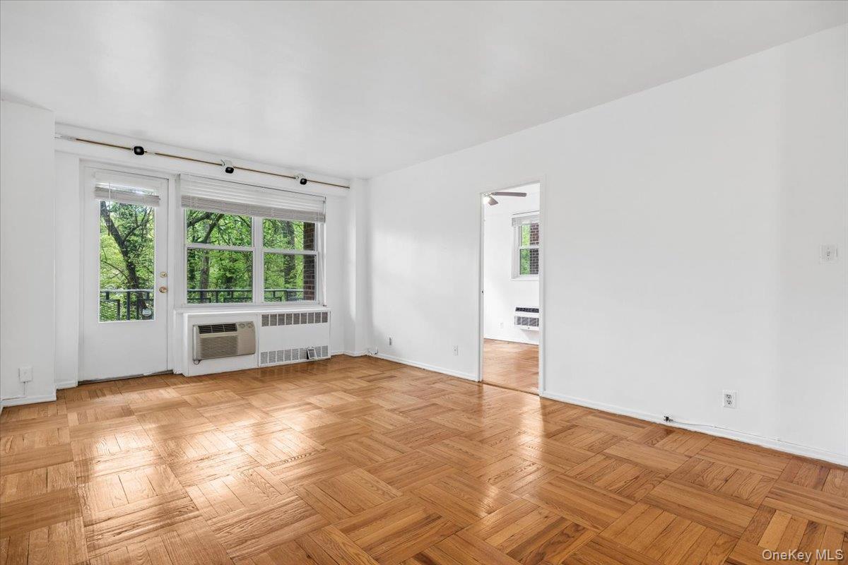 281 Garth Road, Unit C2H Scarsdale, NY 10583 - Photo 12 of 38 a view of an empty room with a window