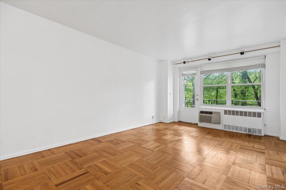 281 Garth Road, Unit C2H Scarsdale, NY 10583 - Photo 13 of 38 an empty room with large windows