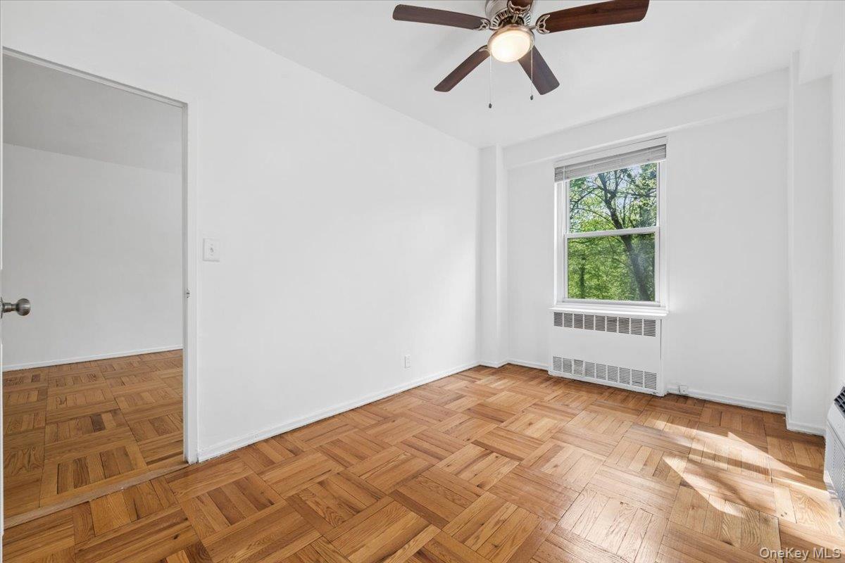 281 Garth Road, Unit C2H Scarsdale, NY 10583 - Photo 17 of 38 a view of an empty room with a window
