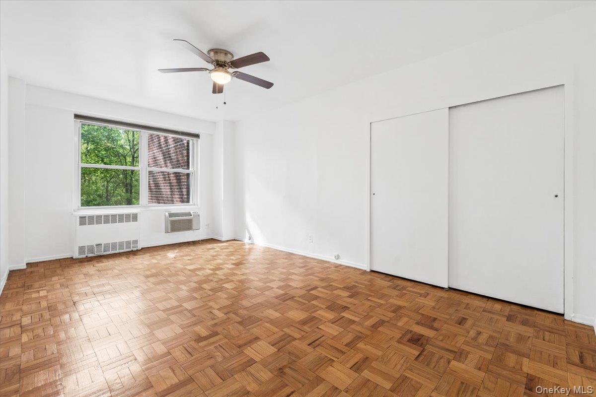 281 Garth Road, Unit C2H Scarsdale, NY 10583 - Photo 19 of 38 a view of an empty room with a window