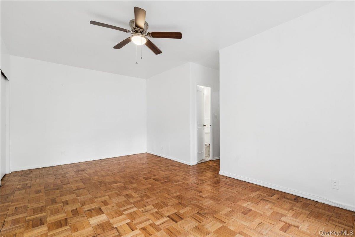 281 Garth Road, Unit C2H Scarsdale, NY 10583 - Photo 23 of 38 a view of a room with a ceiling fan