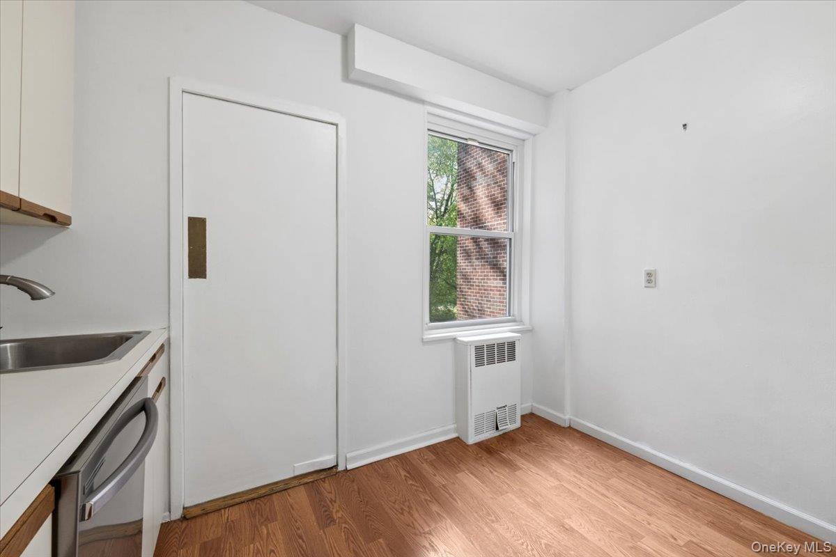 281 Garth Road, Unit C2H Scarsdale, NY 10583 - Photo 26 of 38 a view of an empty room with a window