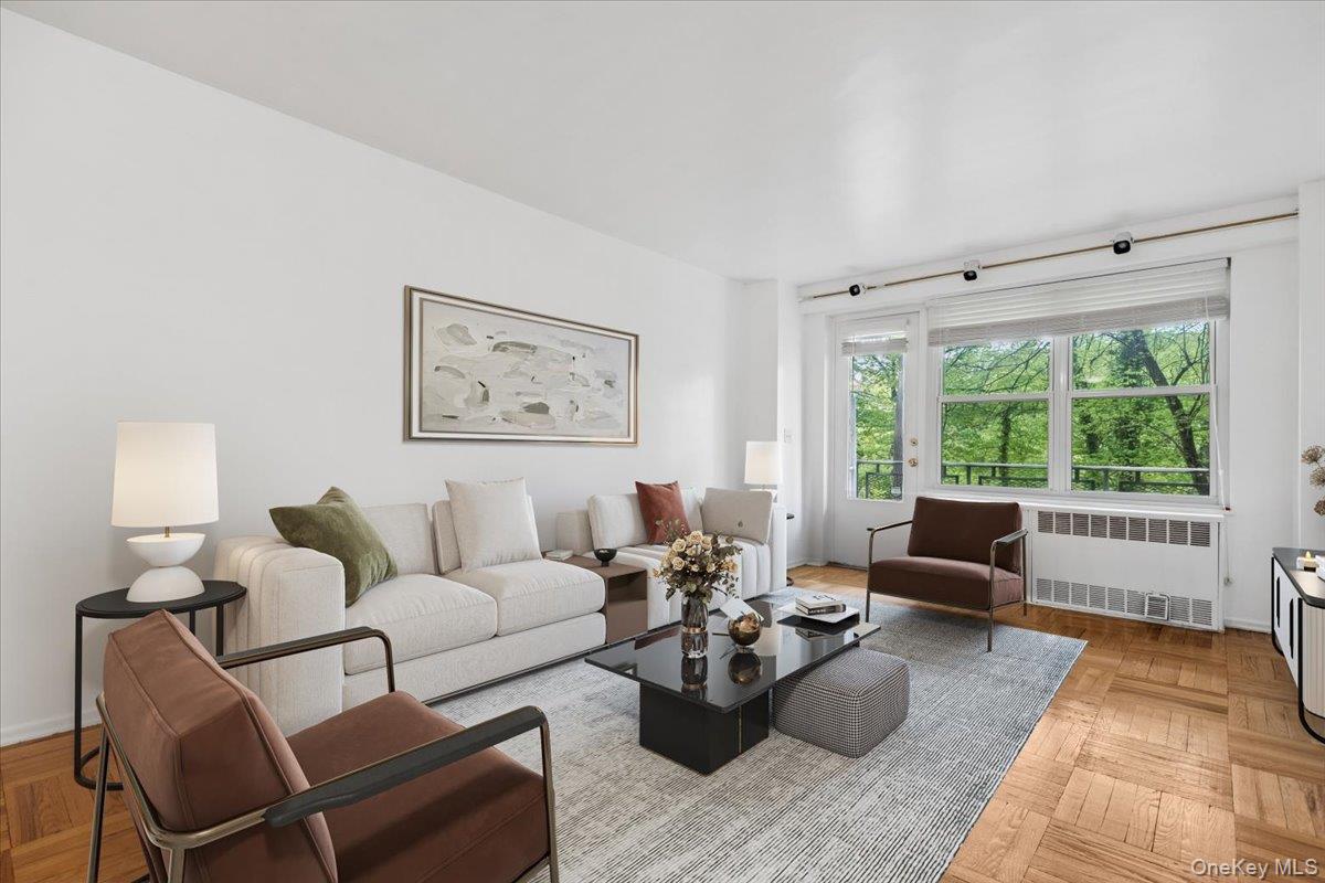 281 Garth Road, Unit C2H Scarsdale, NY 10583 - Photo 7 of 38 a living room with furniture and a large window