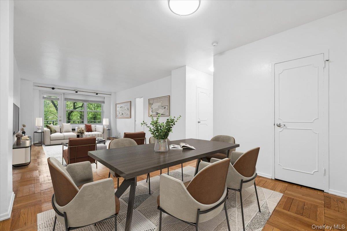 281 Garth Road, Unit C2H Scarsdale, NY 10583 - Photo 9 of 38 a view of a dining room with furniture window and wooden floor