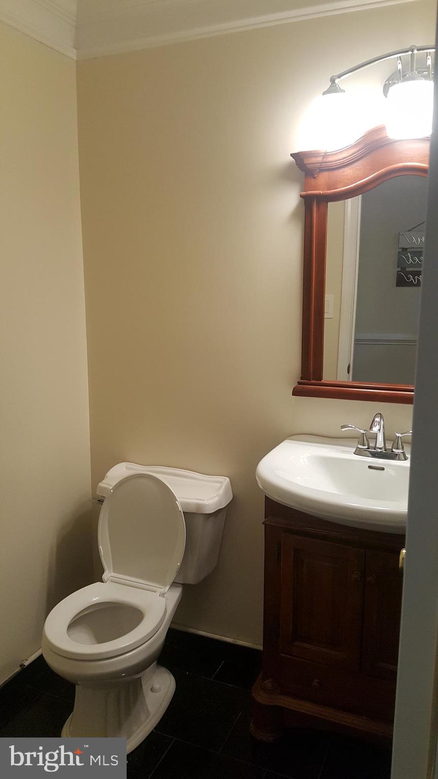 622 Cannon Road Silver Spring, MD 20904 - Photo 15 of 31 Main level Half bath - marble flooring