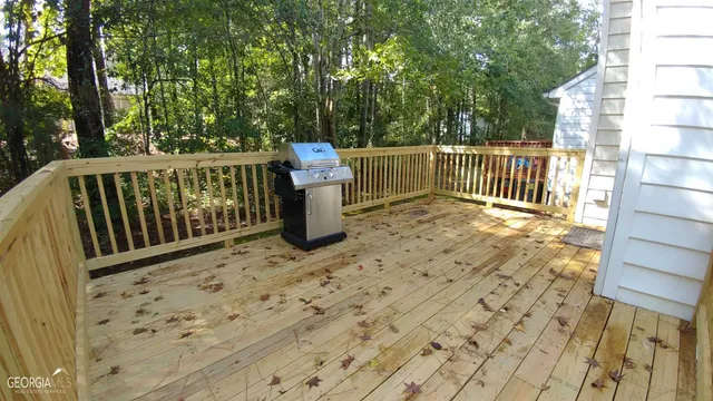 a view of a deck with a wooden fence