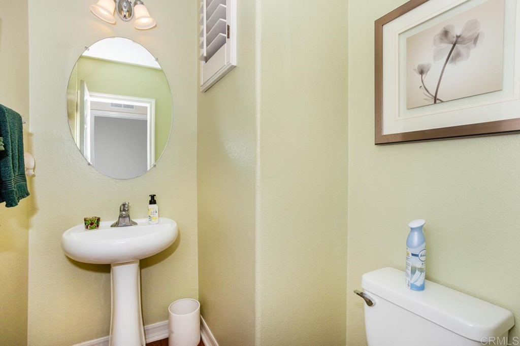 5560 Foxtail Loop Carlsbad, CA 92010 - Photo 11 of 32 a bathroom with a sink and a mirror