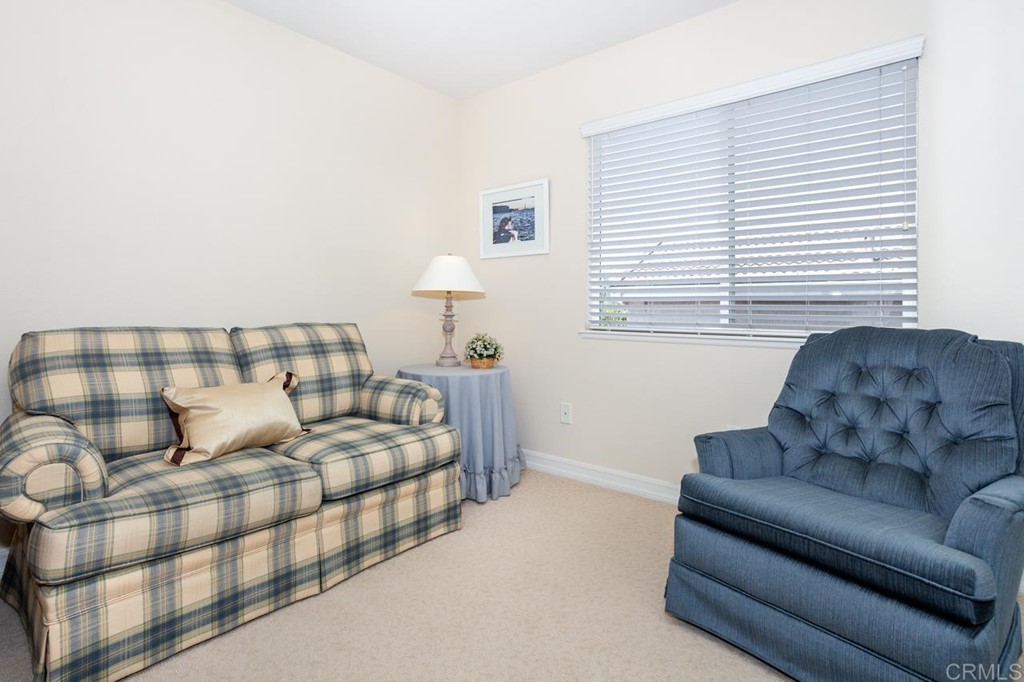 5560 Foxtail Loop Carlsbad, CA 92010 - Photo 12 of 32 a living room with furniture and a large window
