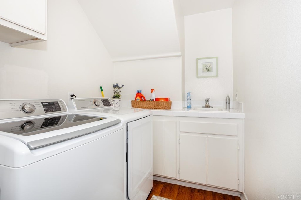 5560 Foxtail Loop Carlsbad, CA 92010 - Photo 18 of 32 a utility room with dryer and washer