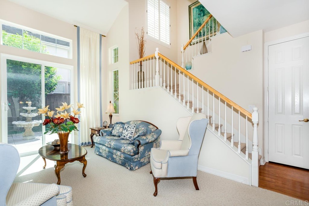 5560 Foxtail Loop Carlsbad, CA 92010 - Photo 2 of 32 a living room with furniture and a table